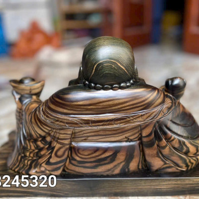 Tượng phật di lặc dâng thỏi vàng để bàn bằng gỗ mun hoa kt 40×23×22cm 