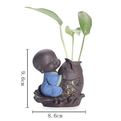 Tượng chú tiểu cưỡi cá chép - trồng cây, cắm hoa để bàn 