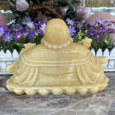 Tượng Phật Di Lặc ngồi tựa bao tiền cầm thỏi vàng phong thủy đá ngọc hoàng long - Dài 30 cm