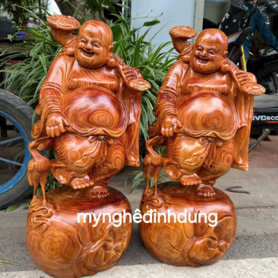 Tượng phật di lặc dắt cò bằng gỗ hương đá cao 40cm