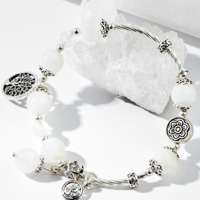 Vòng tay thạch anh ưu linh trắng charm én bạc Ngọc Quý Gemstones